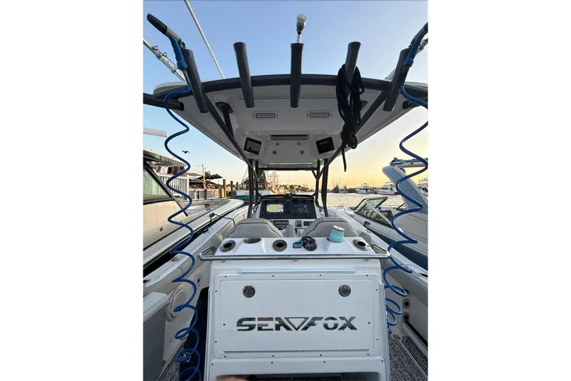 Slide: The Image of 2021 Sea Fox 288 Commander boat interior with helm and equipment at marina. - 7