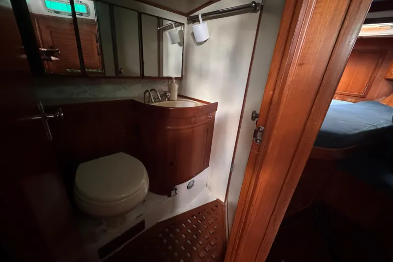 Slide: The Image of 1989 Hylas 44 yacht bathroom with wooden cabinetry and compact design. - 108