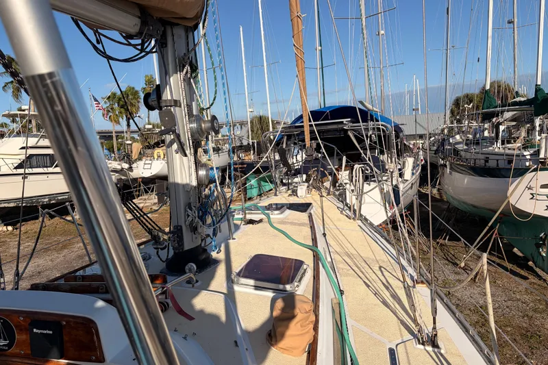 Slide: The Image of 1989 Hylas 44 sailboat docked among other boats under clear blue sky. - 123