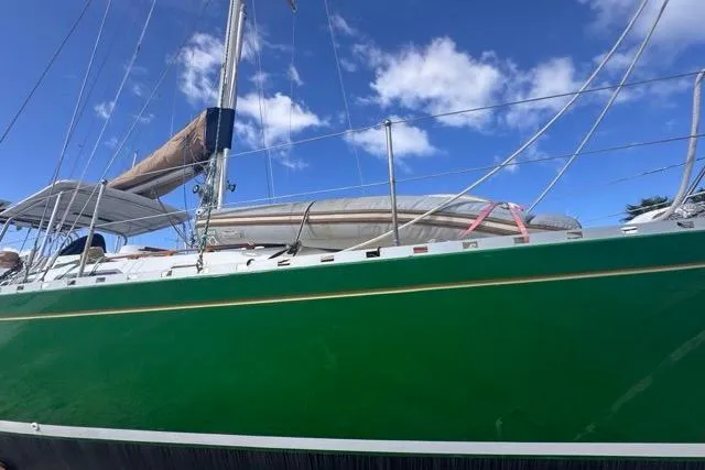 Slide: The Image of Green 1989 Hylas 44 sailboat with blue sky background. - 19