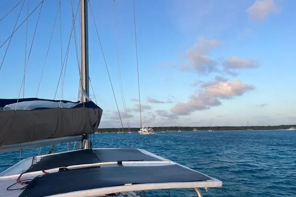 Slide: The Image of Sailing on a 1989 Hylas 44 yacht in clear blue waters under a bright sky. - 24