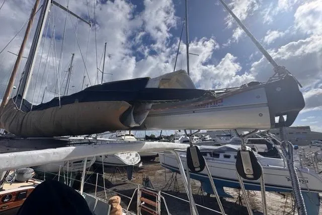 Slide: The Image of Sailboat Hylas 44 from 1989 docked under cloudy sky. - 30