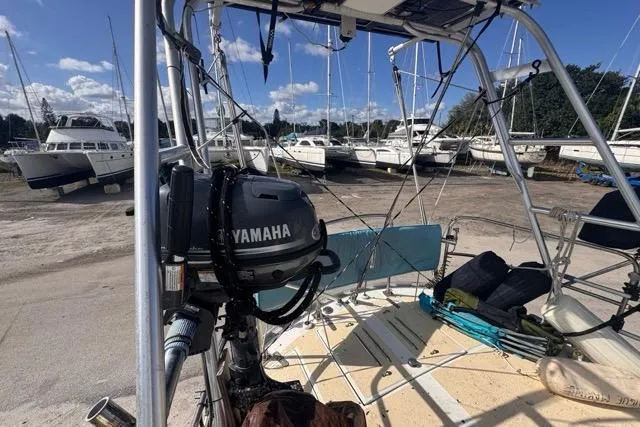 Slide: The Image of 1989 Hylas 44 sailboat with Yamaha motor, docked in a marina with other boats. - 33