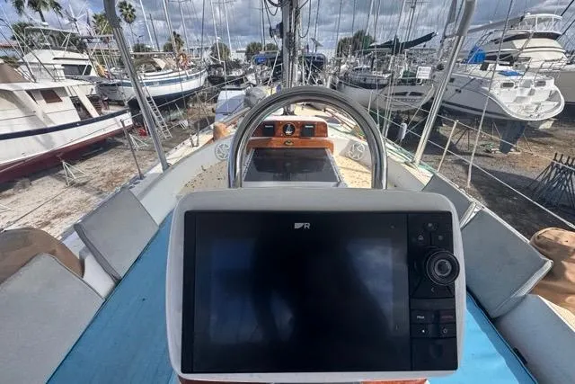 Slide: The Image of Cockpit view of a 1989 Hylas 44 sailboat with navigation equipment. - 36