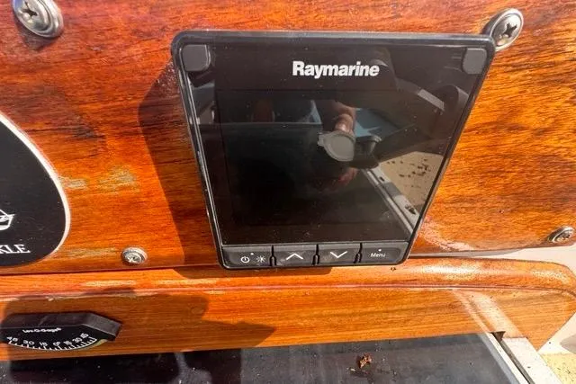 Slide: The Image of Raymarine navigation display on 1989 Hylas 44 yacht's wooden dashboard. - 39