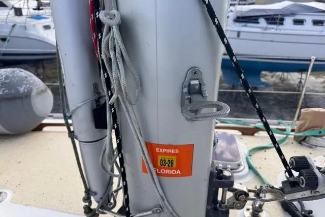 Slide: The Image of Sailboat deck with ropes and equipment, Hylas 44, 1989 model, docked in marina. - 45