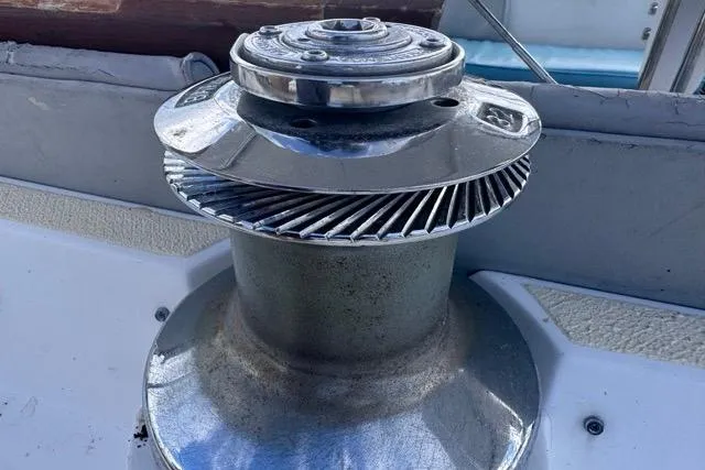 Slide: The Image of Close-up of a winch on a 1989 Hylas 44 sailboat deck. - 49