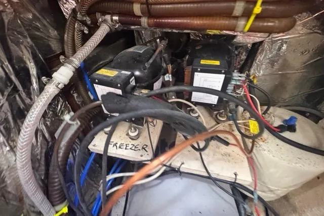 Slide: The Image of Engine room of 1989 Hylas 44 yacht with wiring and equipment. - 85