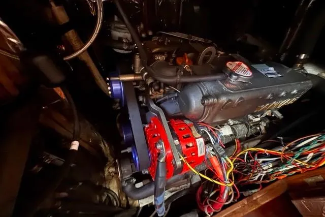 Slide: The Image of Engine compartment of a 1989 Hylas 44 sailboat with visible wiring and components. - 87