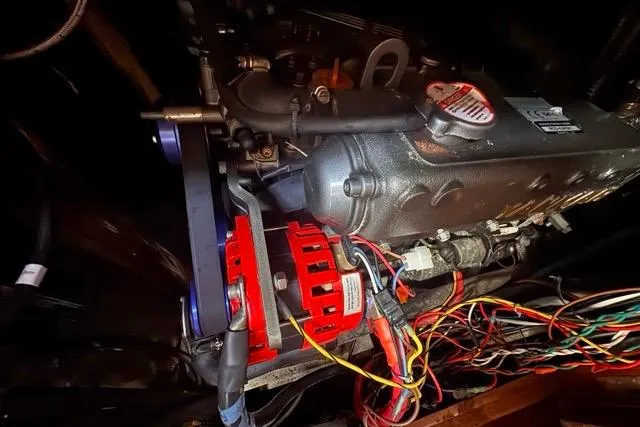 Slide: The Image of Engine compartment of a 1989 Hylas 44 with visible wiring and components. - 88
