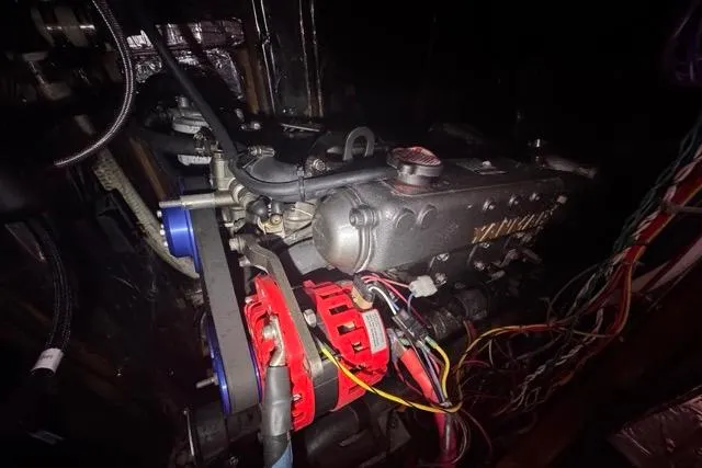 Slide: The Image of Engine of a 1989 Hylas 44 sailboat with visible wiring and components. - 92