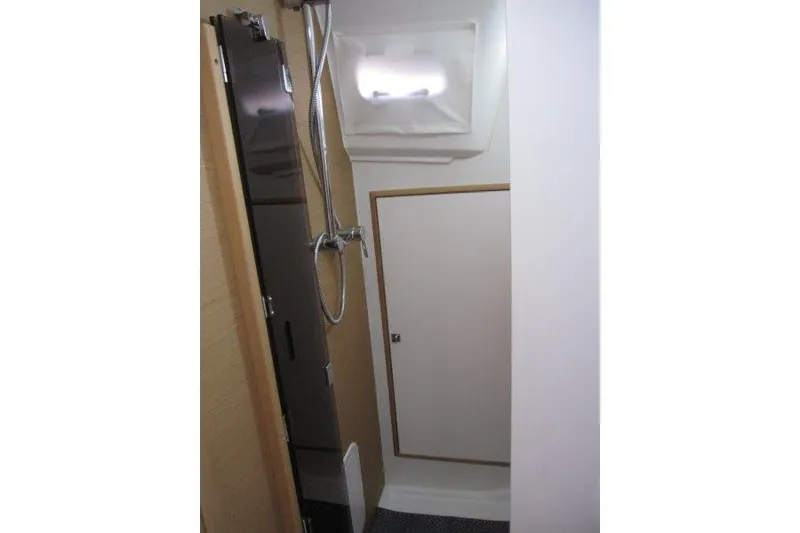 Slide: The Image of Interior of 2021 Jeanneau Sun Odyssey 349 yacht bathroom with shower and storage. - 18