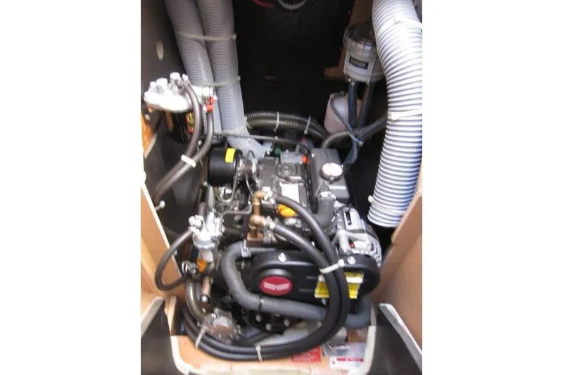 Slide: The Image of Engine compartment of 2021 Jeanneau Sun Odyssey 349 sailboat, showcasing mechanical components. - 21