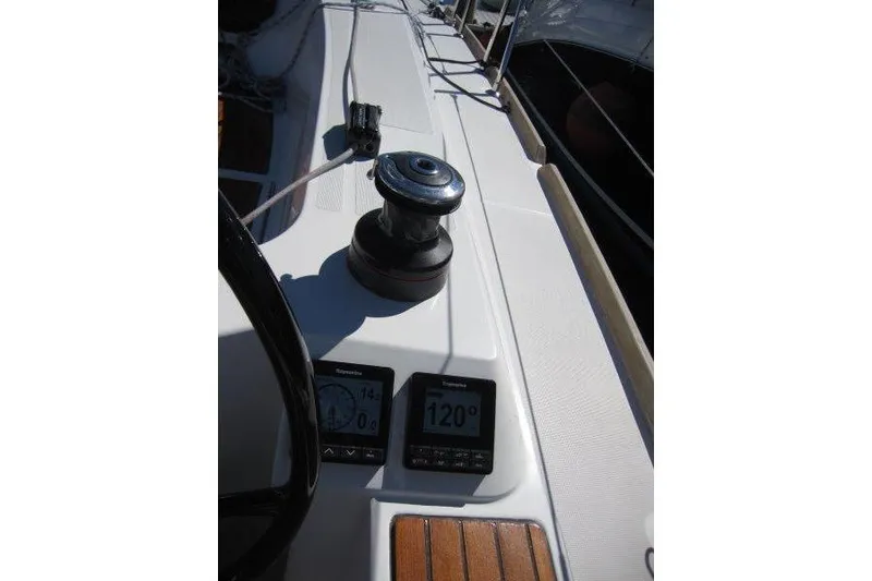 Slide: The Image of Cockpit view of 2021 Jeanneau Sun Odyssey 349 sailboat with winch and navigation instruments. - 23