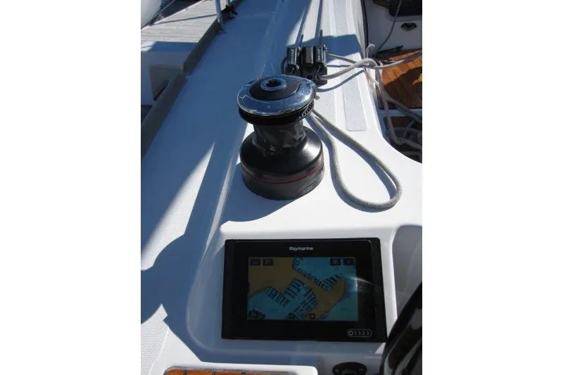 Slide: The Image of Close-up of Jeanneau Sun Odyssey 349 sailboat deck with winch and navigation display. - 26