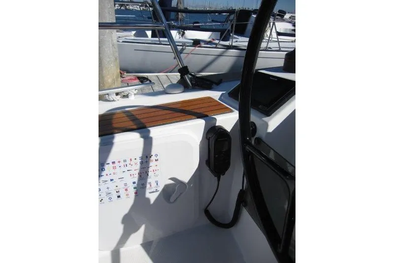 Slide: The Image of Cockpit view of 2021 Jeanneau Sun Odyssey 349 sailboat, featuring control panel and seating. - 28