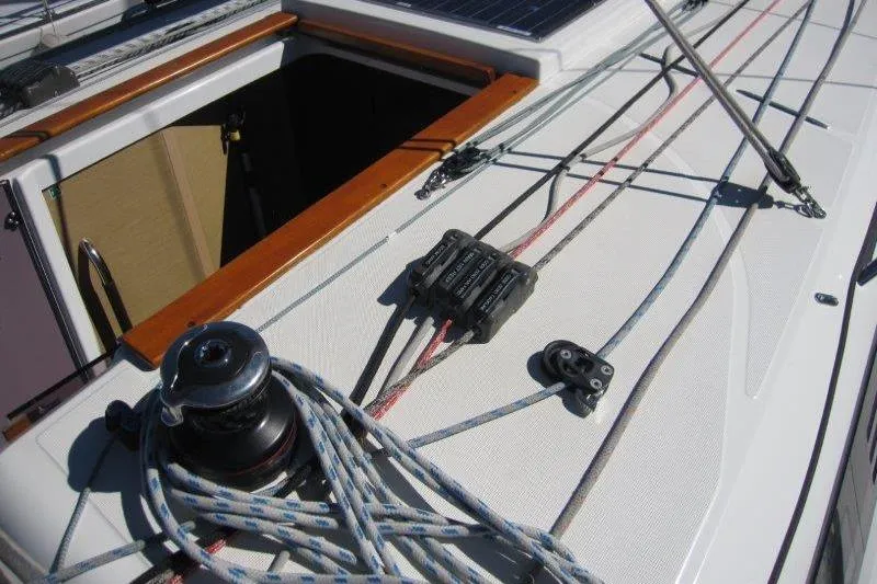 Slide: The Image of Deck view of 2021 Jeanneau Sun Odyssey 349 sailboat with ropes and winch. - 37