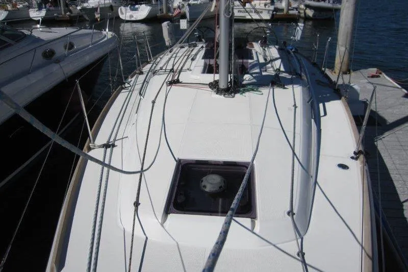 Slide: The Image of 2021 Jeanneau Sun Odyssey 349 sailboat docked at marina, top deck view. - 39