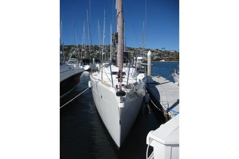 Slide: The Image of 2021 Jeanneau Sun Odyssey 349 sailboat docked at marina under clear blue sky. - 42