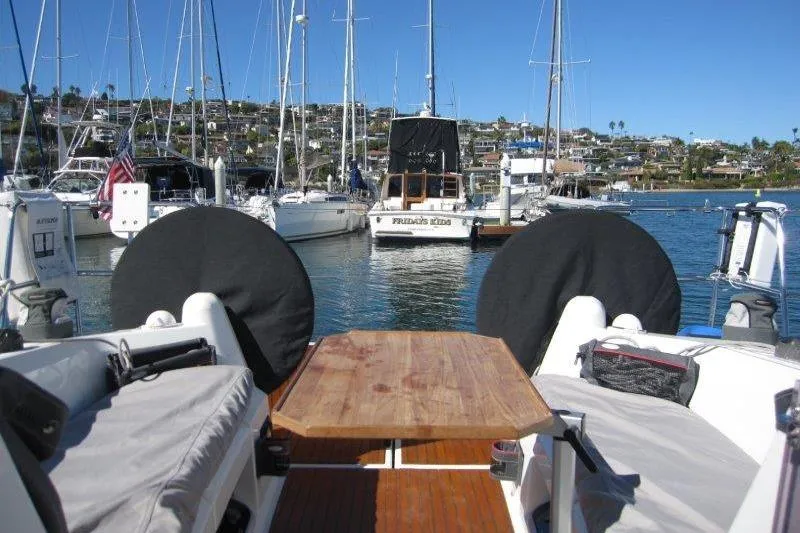Slide: The Image of Jeanneau Sun Odyssey 349 sailboat, 2021 model, docked in a marina with clear blue skies. - 48