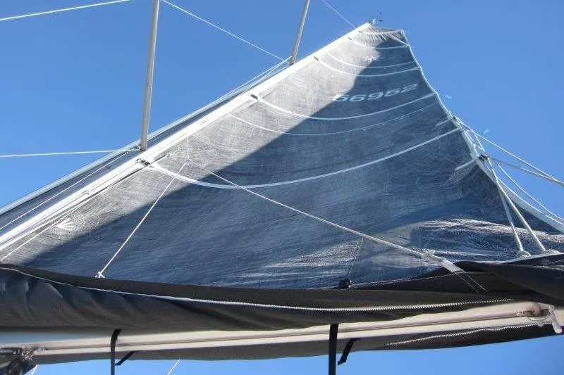 Slide: The Image of Sail of Jeanneau Sun Odyssey 349, 2021 model, against a clear blue sky. - 53