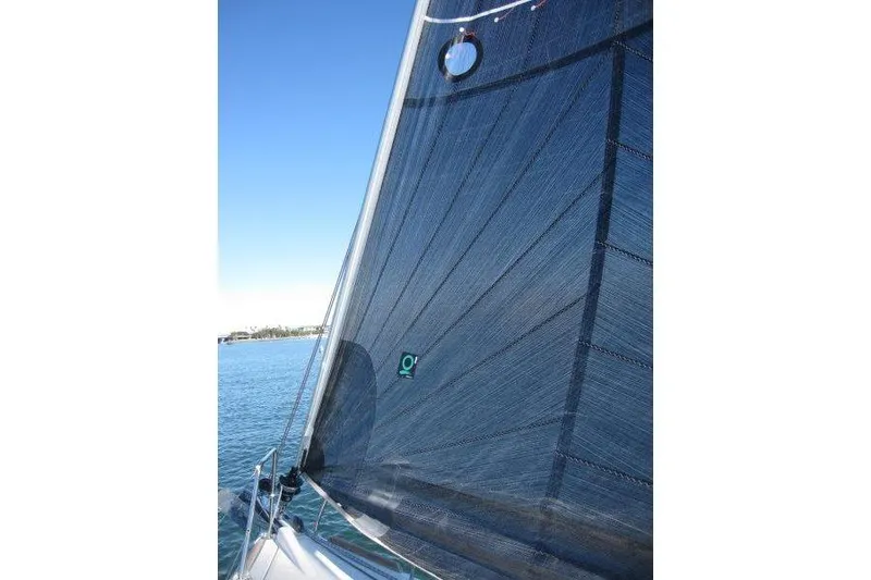 Slide: The Image of Sail of 2021 Jeanneau Sun Odyssey 349 against clear blue sky. - 54