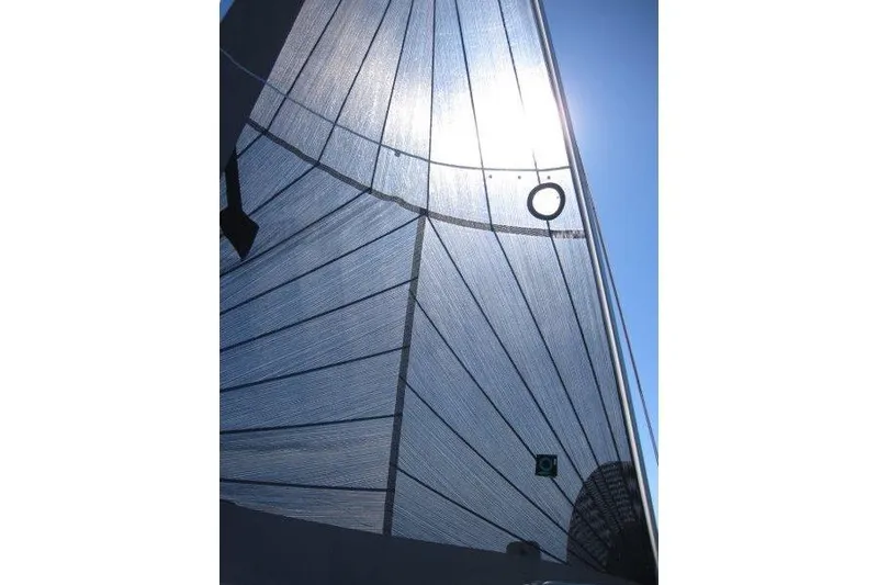 Slide: The Image of Sail of 2021 Jeanneau Sun Odyssey 349 yacht against clear blue sky. - 55