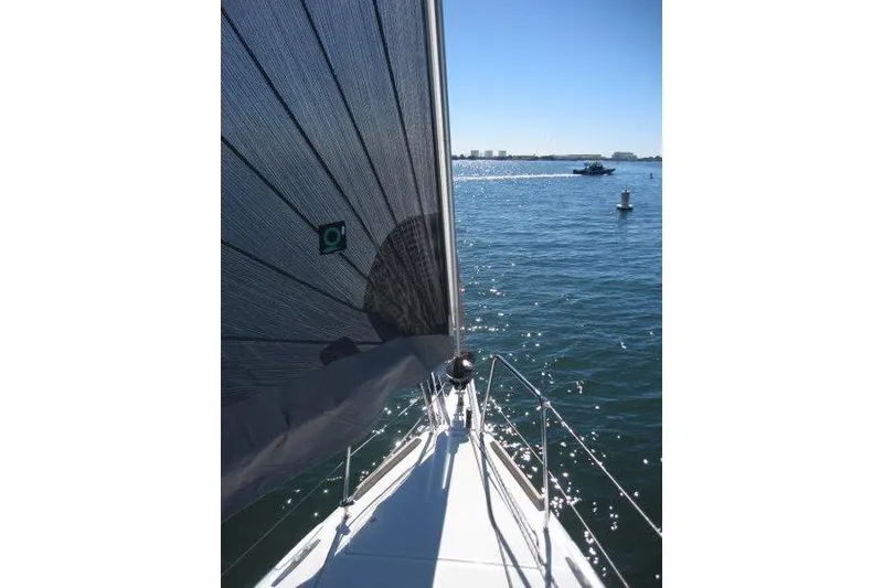 Slide: The Image of 2021 Jeanneau Sun Odyssey 349 sailing on a sunny day, with clear blue waters. - 58