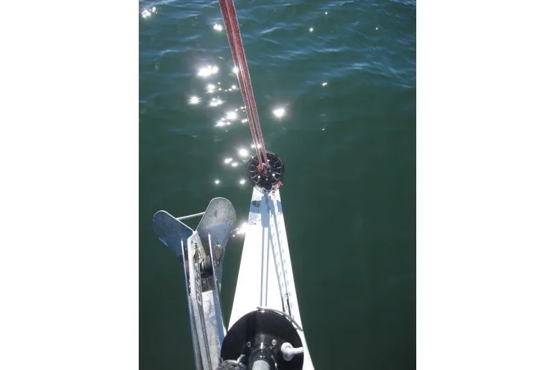 Slide: The Image of Bow view of Jeanneau Sun Odyssey 349 sailboat, 2021 model, with anchor and sparkling water. - 59