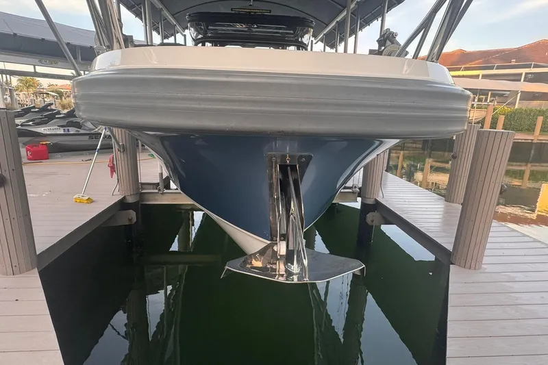 Slide: The Image of Nimbus T9 boat docked, front view, showcasing sleek design and anchor. - 19
