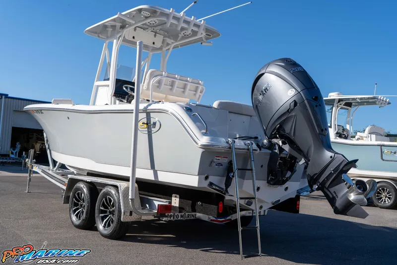 Slide: The Image of 2025 Sea Hunt Ultra 229 boat on trailer with Yamaha outboard motor. - 22
