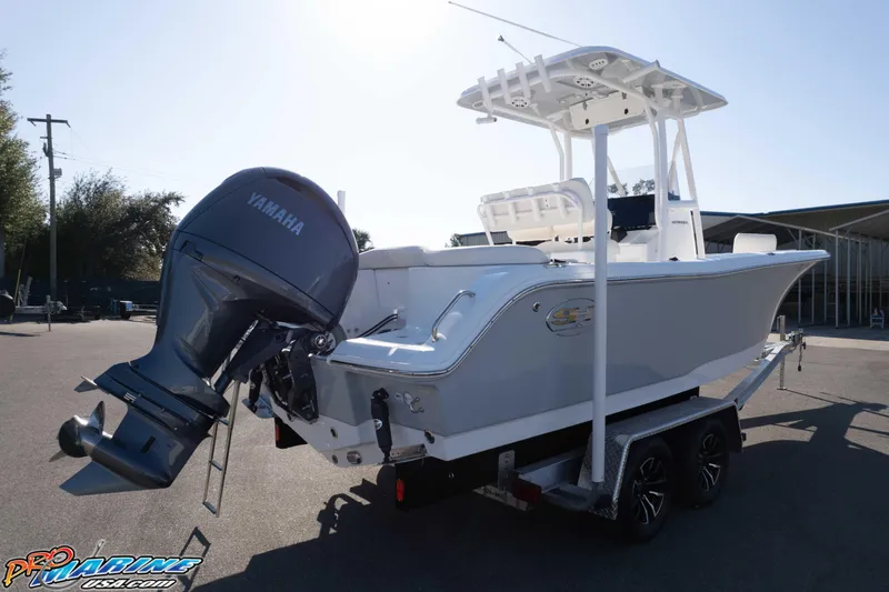 Slide: The Image of 2025 Sea Hunt Ultra 229 boat with Yamaha engine on trailer. - 23