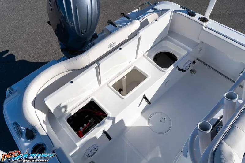Slide: The Image of 2025 Sea Hunt Ultra 229 boat interior with storage compartments and seating. - 35