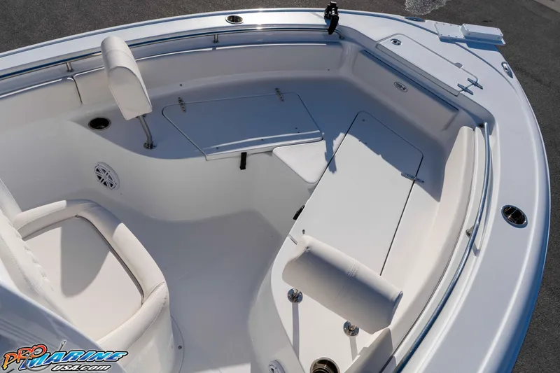Slide: The Image of 2025 Sea Hunt Ultra 229 boat interior with seating and storage compartments. - 38