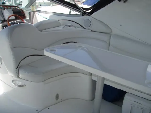 Slide: The Image of Interior of 2003 Wellcraft 3300 Martinique boat with white seating and table. - 10
