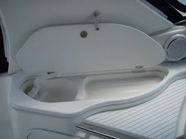 Slide: The Image of 2003 Wellcraft 3300 Martinique boat interior storage compartment with open lid. - 13