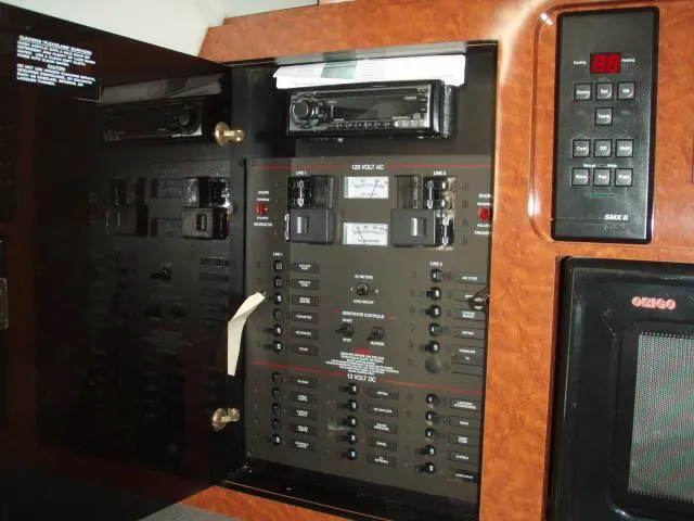 Slide: The Image of Electrical control panel inside a 2003 Wellcraft 3300 Martinique boat. - 19
