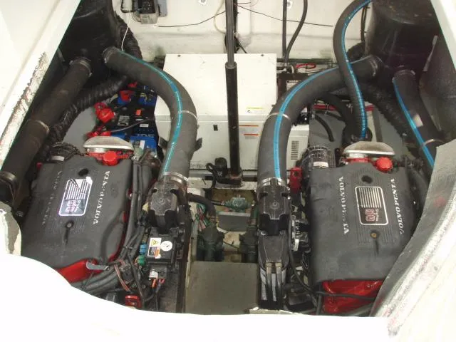 Slide: The Image of Engine compartment of a 2003 Wellcraft 3300 Martinique boat, featuring dual Volvo Penta engines. - 23