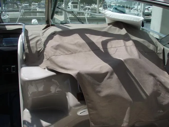 Slide: The Image of 2003 Wellcraft 3300 Martinique boat interior with protective cover. - 7
