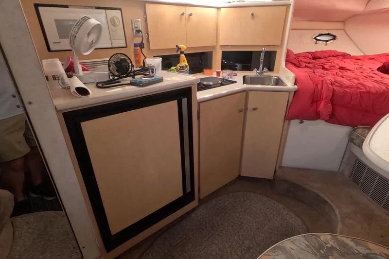 Slide: The Image of Interior of 2000 Bayliner 2855 Ciera boat with kitchenette and sleeping area. - 12