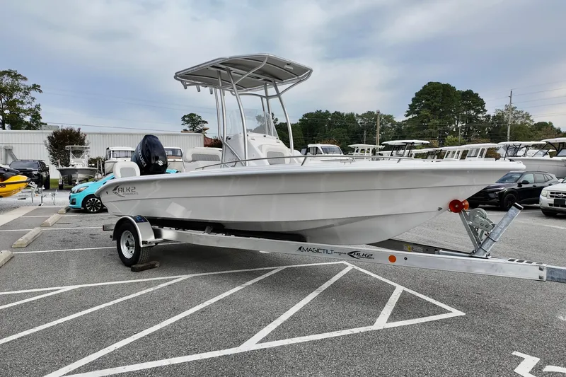 Slide: The Image of 2026 ALK2 22CRX boat on trailer in parking lot, overcast sky. - 3