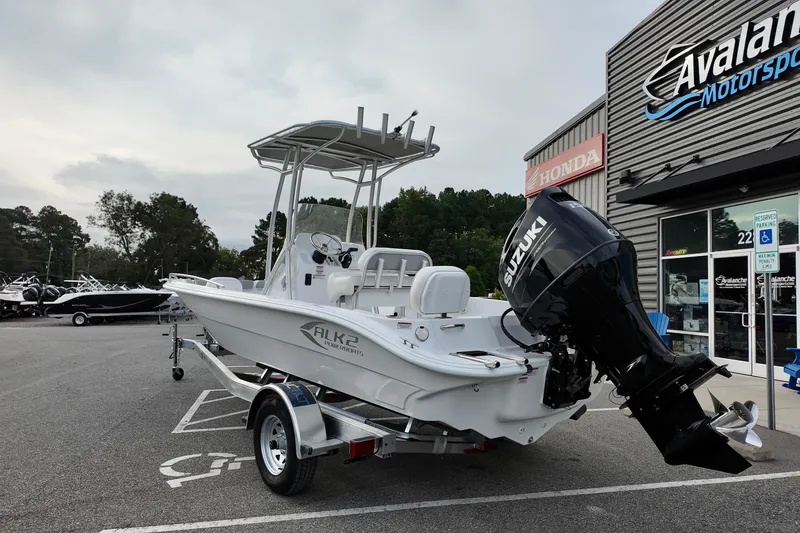 Slide: The Image of 2026 ALK2 22CRX boat with Suzuki engine at dealership, parked outside Avalanche Motorsports. - 5