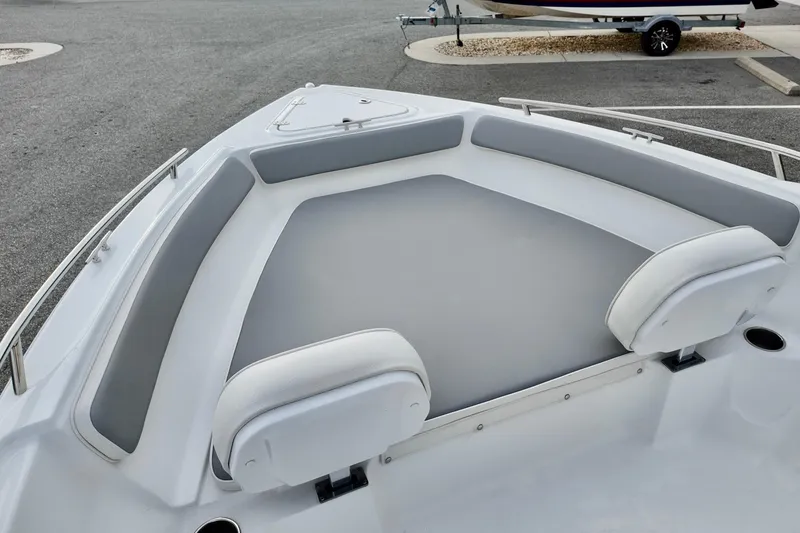 Slide: The Image of Bow seating area of 2026 ALK2 22CRX boat with gray cushions. - 6
