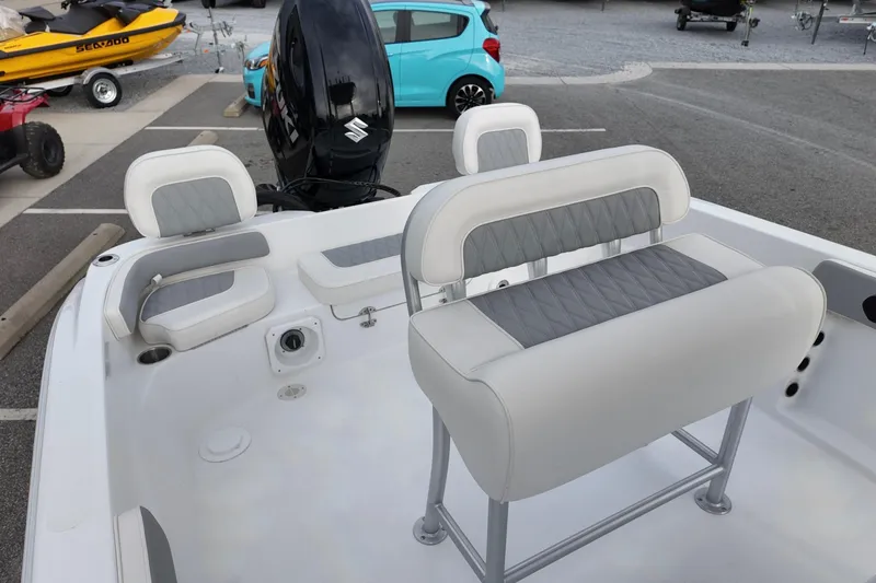 Slide: The Image of Interior of ALK2 22CRX 2026 boat with cushioned seating and Suzuki outboard motor. - 9