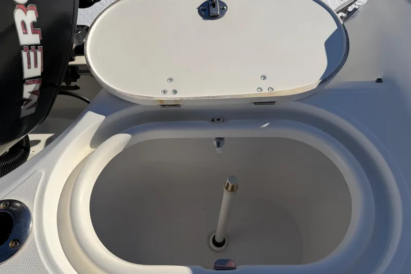 Slide: The Image of Open storage compartment on a 2006 Boston Whaler 180 Ventura boat. - 16