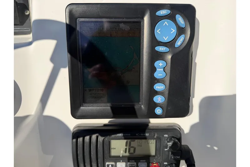 Slide: The Image of Control panel of a 2006 Boston Whaler 180 Ventura boat with navigation equipment. - 18