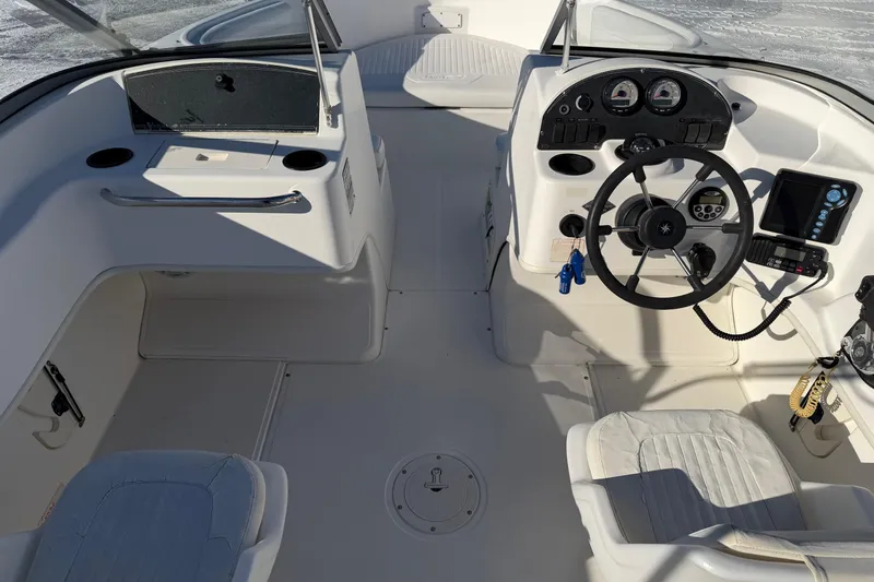 Slide: The Image of 2006 Boston Whaler 180 Ventura boat interior with steering wheel and control panel. - 9