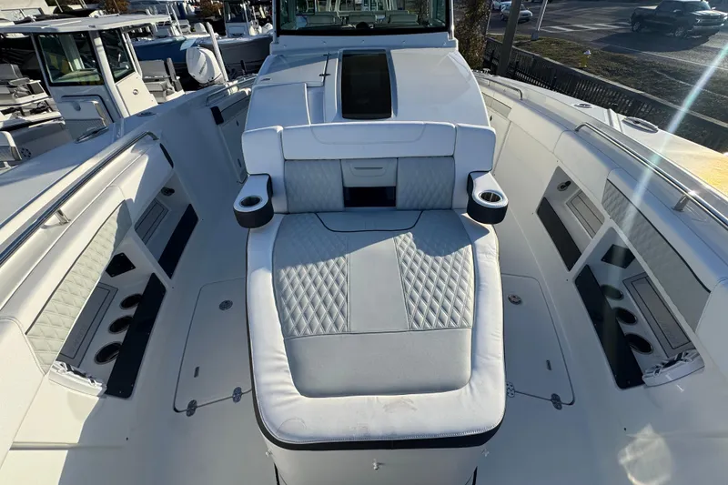 Slide: The Image of 2026 Blackfin 400 CC boat cockpit with modern controls and seating. - 10