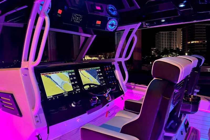Slide: The Image of Manufacturer Provided Image: 2026 Blackfin 400 CC boat interior with blue LED lighting and luxurious seating. - 22