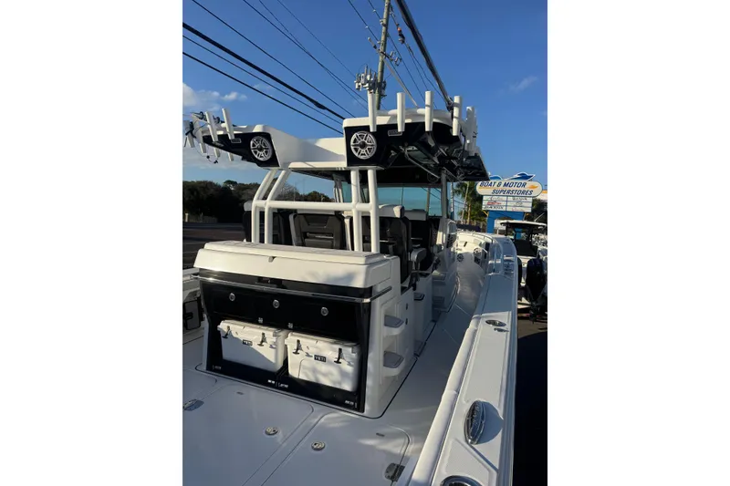 Slide: The Image of 2026 Blackfin 400 CC boat interior with storage and Yeti coolers. - 5